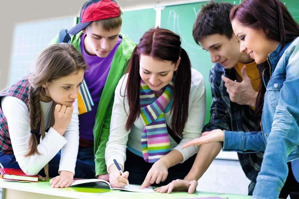 Look at the children they are. Two pupils discussing. Group discussion pupil. Students discussing Curriculum. Teaching is Love.